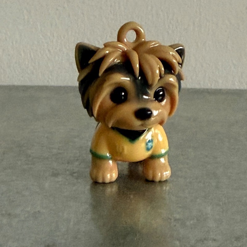 Custom pet keychain of a Yorkshire terrier in a yellow shirt, with its keyring loop