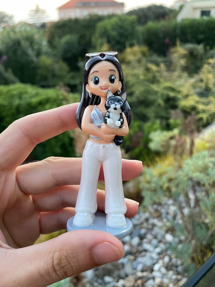 The same young woman, with her cat, as a finished MiniME figurine